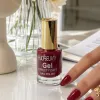 Red nail polish bottle with golden cap, specially designed for nail art painting, fashionable color display, long-lasting and no fading details Picture